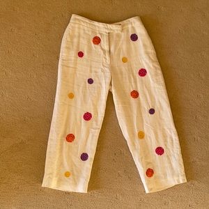 White linen pants with embroidered flowers